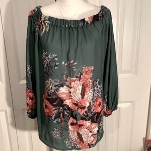 NWOT…. Off the shoulder top. Beautiful colors size XL